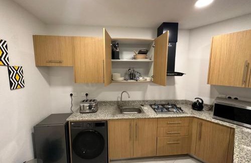 Benin City Apartamento | Golf Mews