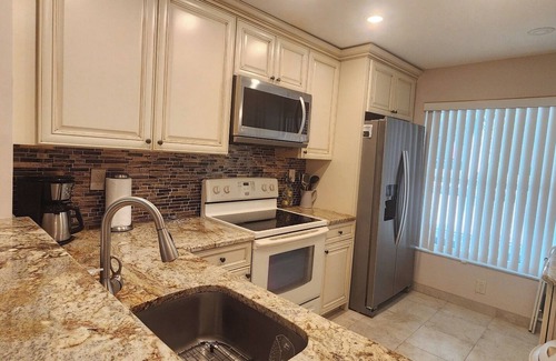 Casa del Mar Condominio | Gorgeous Second Floor Waterfront Villa with Sunset views over Boca Ciega Bay!