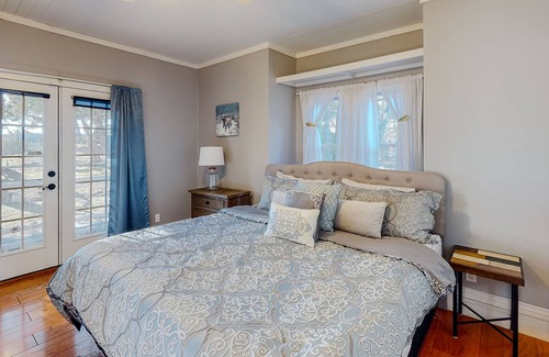 Holiday Island Casa | Gorgeous water view home with a fireplace, outdoor space & central AC