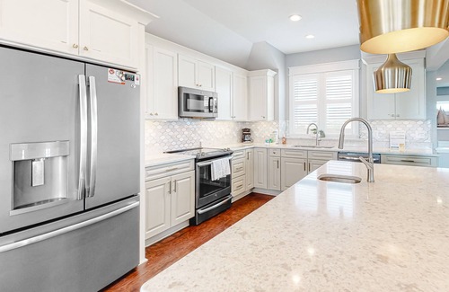 Ocean Isle Estates Casa | Grand beach home with elevator, private hot tub, game room, & pool access