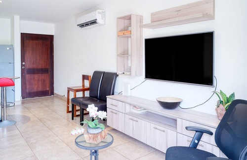 Villarreal Condominio | Ground-floor condo with pool & garden views, terrace, hot tub, AC, & W/D