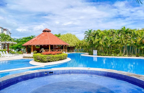 Villarreal Condominio | Ground-floor condo with pool & garden views, terrace, hot tub, AC, & W/D