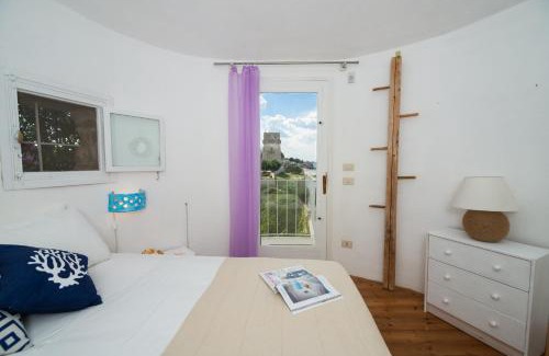 Bisceglie Villa | HelloAPULIA - Sweet Trullo on the Beach - Unique Seafront house with Direct Beach "Ponte Lama" Access and Private Patio