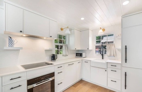 West Bay Cabaña | Historic Boggy Sand Wood Cottage with Pool & Private Seven Mile Beach Access