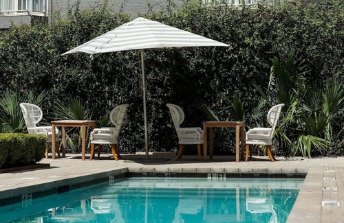 West Campus Hotel | Historic Elegance Meets Modern Comfort – Enjoy On-Site Dining & Bar