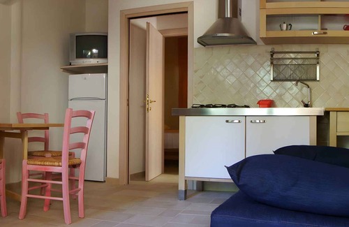 Santa Margherita di Pula Apartamento | Apartamento vacacional entre mar y piscina