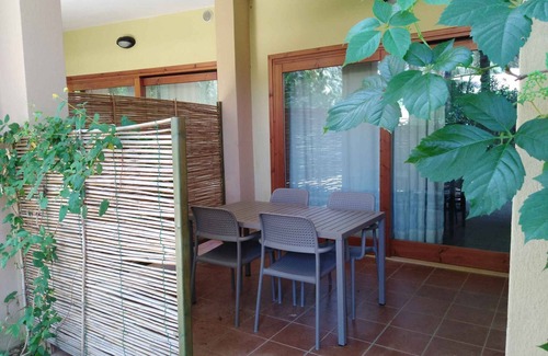 Santa Margherita di Pula Apartamento | Apartamento vacacional entre mar y piscina