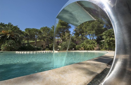 Santa Margherita di Pula Apartamento | Apartamento vacacional entre mar y piscina