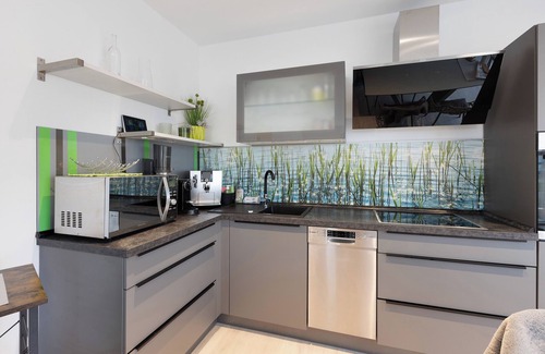 Muldestausee Apartamento | Apartamento vacacional "20b Am Goitzsche See" con vistas al lago, terraza privada y Wi-Fi