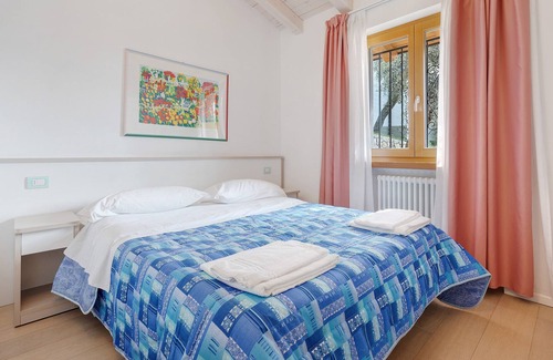 Magugnago Apartamento | Apartamento vacacional "Casa-Lago Suite" con vistas al lago, piscina compartida y Wi-Fi