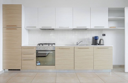 Golfo Aranci Apartamento | Apartamento vacacional "Villa Marconi 5" con vistas al mar, terraza cubierta y amplio jardín