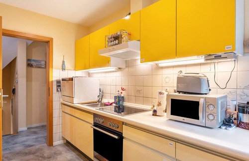 Fockbek Apartamento | Apartamento vacacional 'Lütt Stuv' con terraza privada, jardín comunitario y Wi-Fi