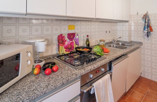Bibione Apartamento | Apartamento vacacional Con solarium y chimenea exterior.