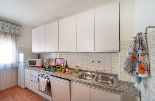 Bibione Apartamento | Apartamento vacacional Con solarium y chimenea exterior.