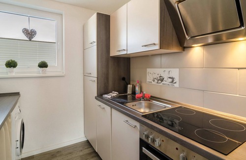 Wangerland Apartamento | Apartamento vacacional 'Nordsee' con terraza compartida, jardín compartido y Wi-Fi