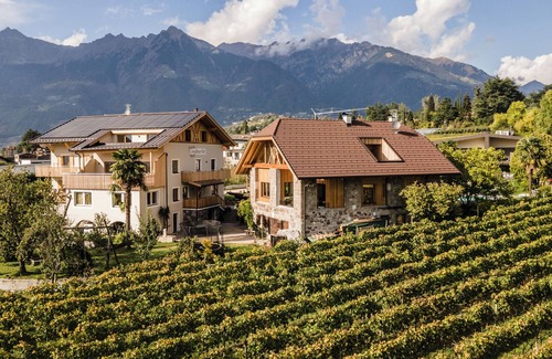 Merano Apartamento | Apartamento vacacional "Torgglbauer 2" con vistas a la montaña, piscina, terraza y Wi-Fi