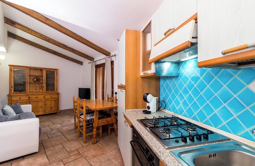 Porto San Paolo Casa | Casa de vacaciones "Villa Teresa" con piscina compartida, terraza privada y aire acondicionado