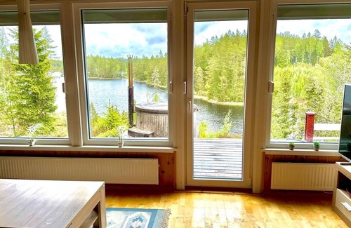 Tived Casa | Holiday home Tived - directly on lake, sauna, boat, hot tub