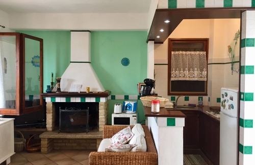 Santa Margherita di Pula Casa | casa de vacaciones en Cerdeña en una playa de arena de La Perla Marina