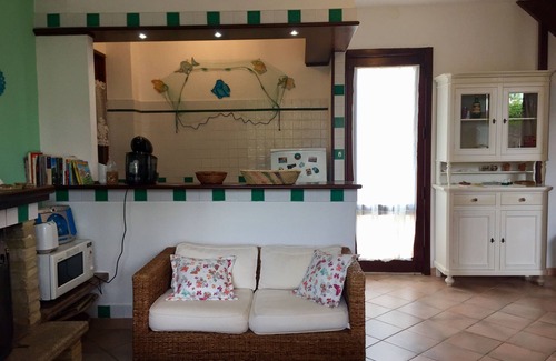 Santa Margherita di Pula Casa | casa de vacaciones en Cerdeña en una playa de arena de La Perla Marina