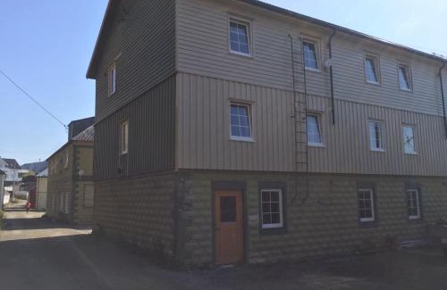 Oksnes Apartamento | Holiday in the former fishing factory Arntzen-brygga