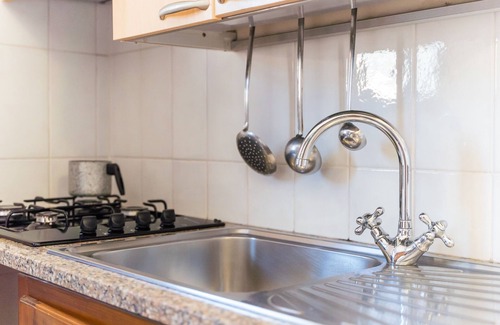 Capo Testa Apartamento | Apartamento vacacional 'Giovanni' con vistas al mar, terraza privada, aire acondicionado y Wi-Fi