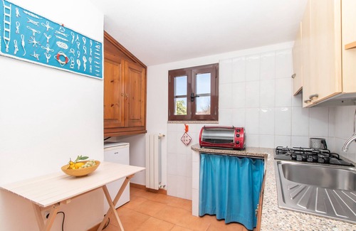 Capo Testa Apartamento | Apartamento vacacional 'Giovanni' con vistas al mar, terraza privada, aire acondicionado y Wi-Fi