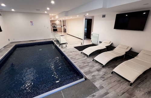 Kauneonga Lake Villa | Home king luxury, waterfront hot tub, family , indoor pool, private beach