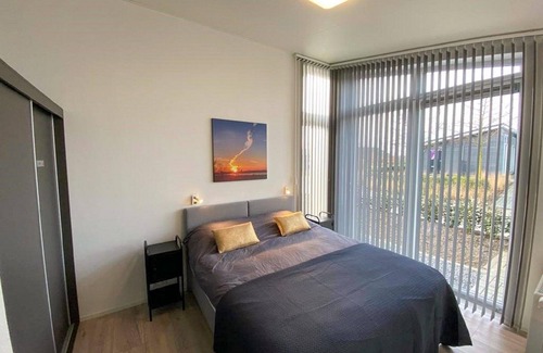 Wemeldinge Casa | Home with modern interior with air conditioning and view of the forest.