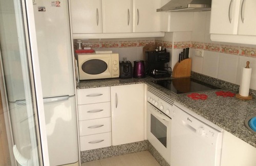 Puerto Rey Apartamento | Acogedor apartamento en El Faro con piscina, terraza, balcón, aire acondicionado y Wi-Fi