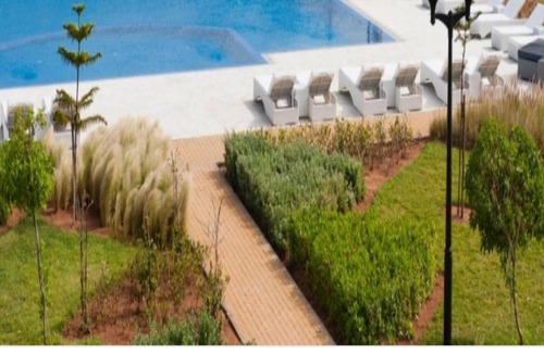 Sidi Rahal Apartamento | Homerez - ¡A 10 m de la playa! Apartamento para 5 pers. con piscina compartida