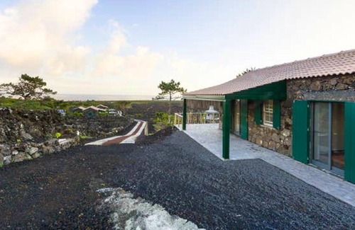 Sao Roque do Pico Casa | Homerez - Casa para 4 pers. con piscina compartida, jacuzzi y jardín en Lajido