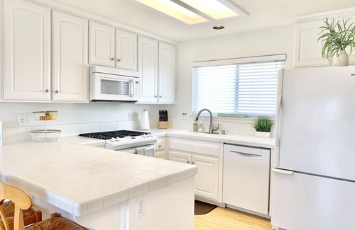 Downtown Condominio | Host By Owner! Family Size Condo! Walk to the Beach & Downtown! Two-car garage!