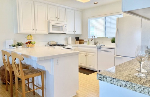 Downtown Condominio | Host By Owner! Family Size Condo! Walk to the Beach & Downtown! Two-car garage!