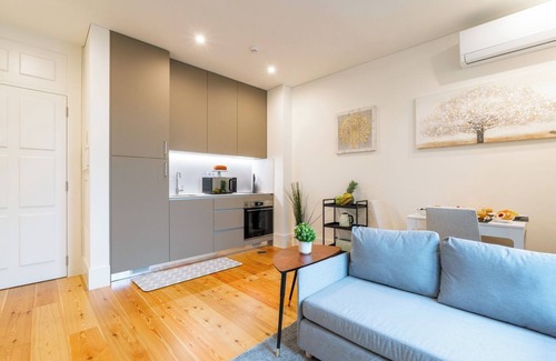 Guimaraes Apartamento | HostWise - Bright and Cozy Flat w/ Balcony
