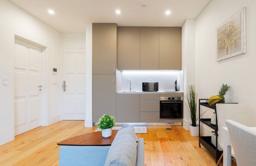 Guimaraes Apartamento | HostWise - Bright and Cozy Flat w/ Balcony