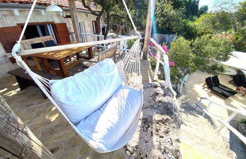 Hvar Casa | house for two with a private terrace located directly on the beach, town Hvar