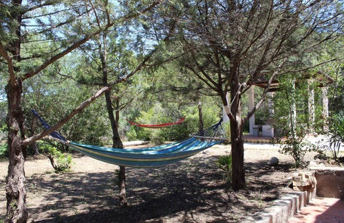 Cala Liberotto Apartamento | Casa de madroños a tiro de piedra del hermoso mar en Calaliberotto