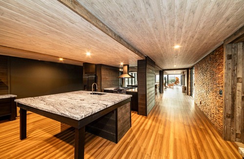 Yucca Valley Casa | Iconic 7,000sf Glass Villa + Soaking Pool