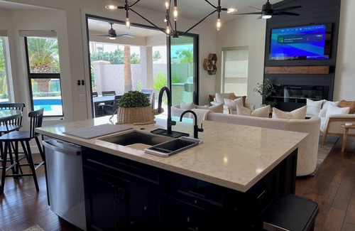 Crystal Shores Casa | IMPRESSIVE Val Vista Lake front w/VIEW: Heated Pool, Patio TV, Fishing