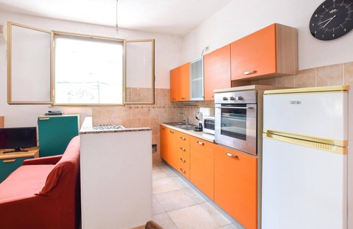 Cala Liberotto Casa | In the small seaside resort of Cala Liberotto, this practical vacation home welcomes you.