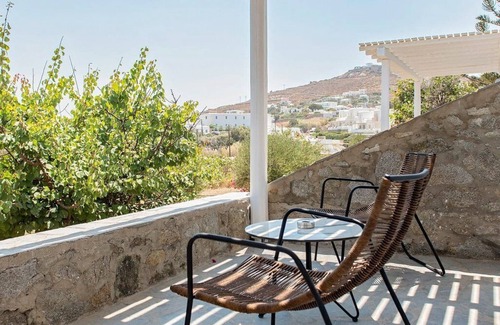 Ornos Villa | Incredible Mykonos Apartment | Apartment Revchi | 2 Bedrooms | Family Garden View Suite | Spacious Shared Swimming Pool Surrounded with Furnished Sun Terrace | Korfos, Ornos