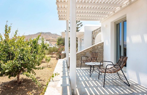 Ornos Villa | Incredible Mykonos Apartment | Apartment Revchi | 2 Bedrooms | Family Garden View Suite | Spacious Shared Swimming Pool Surrounded with Furnished Sun Terrace | Korfos, Ornos