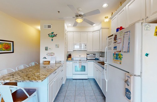 Hatteras Condominio | Inviting beachfront condo featuring hot tub & pool, central AC, elevator, & deck