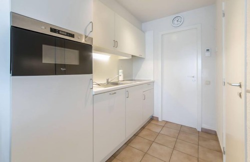 De Haan Apartamento | Isabelle with parking and shared pool by Interhome