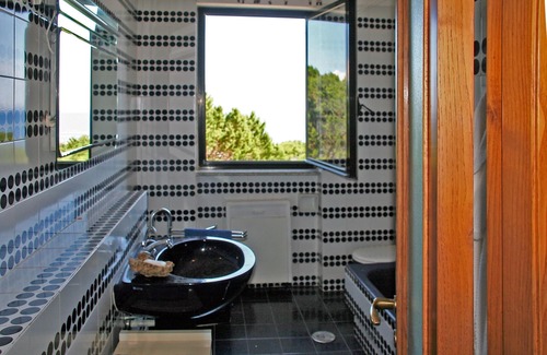 Capo Testa Apartamento | Casa de vacaciones con vista y jardín a la cabeza de la casa.