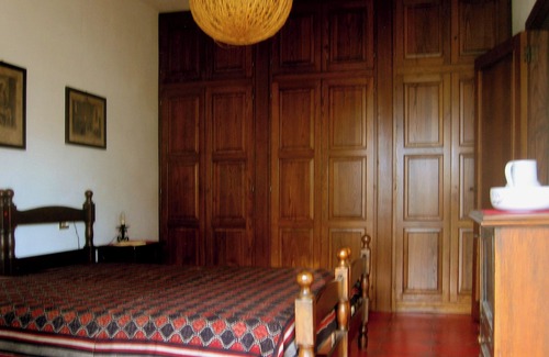 Capo Testa Apartamento | Casa de vacaciones con vista y jardín a la cabeza de la casa.