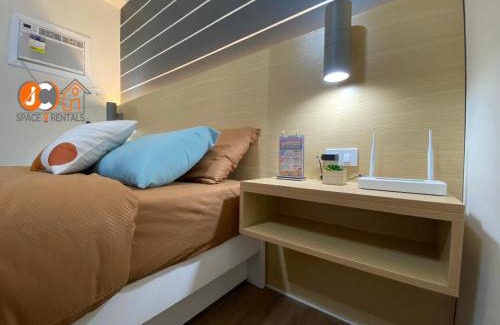 Mactan Export Processing Zone Apartamento | JC SpaceRentals 127B Amani Grand Resort Residences, balcony pool view, Ground floor, 5 mins frm airport, free wifi, Netflix