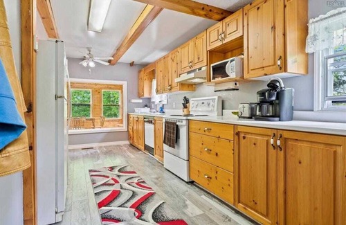 Aldersville Cabaña | June's Haven" is a picturesque lakeside cottage perfect for fishing