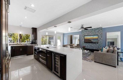 Central Fort Lauderdale Casa | Just 10min to downtown Ft. Lauderdale & beach, this modern home offers everything a group could want for an upscale relaxing getaway. Unwind in the very private and peaceful backyard oasis, featuring a heated ($) pool, 6-person hot tub & fire pit.